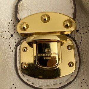 Gentle used Mahina Hobo by Louis Vuitton.